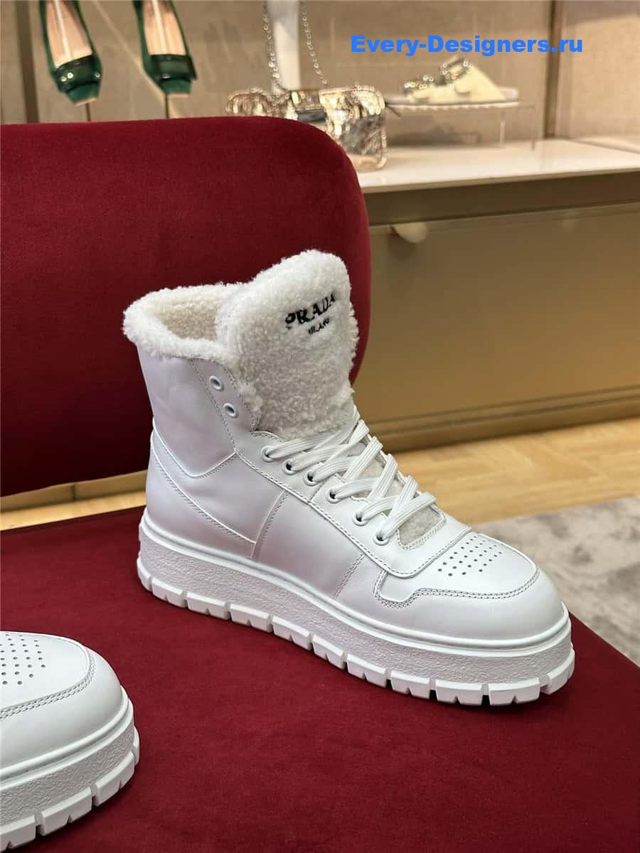 Pra*a white triangle-logo high-top leather sneakers