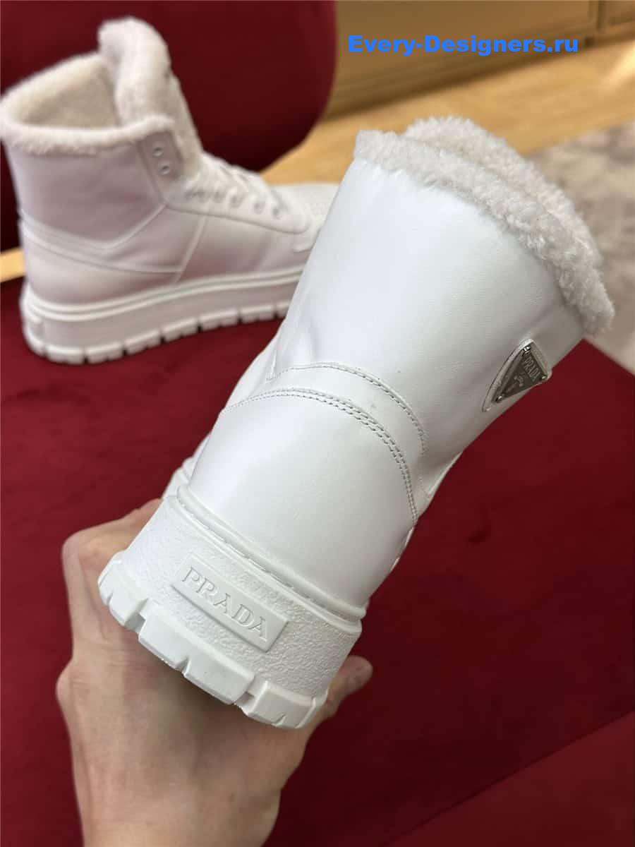 Pra*a white triangle-logo high-top leather sneakers