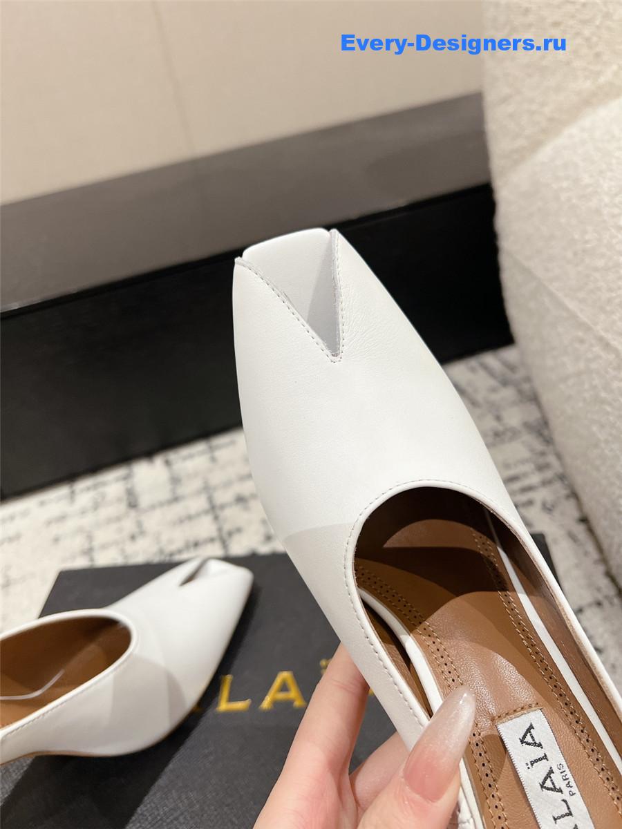 Alaia White Spike Mules in Calfskin