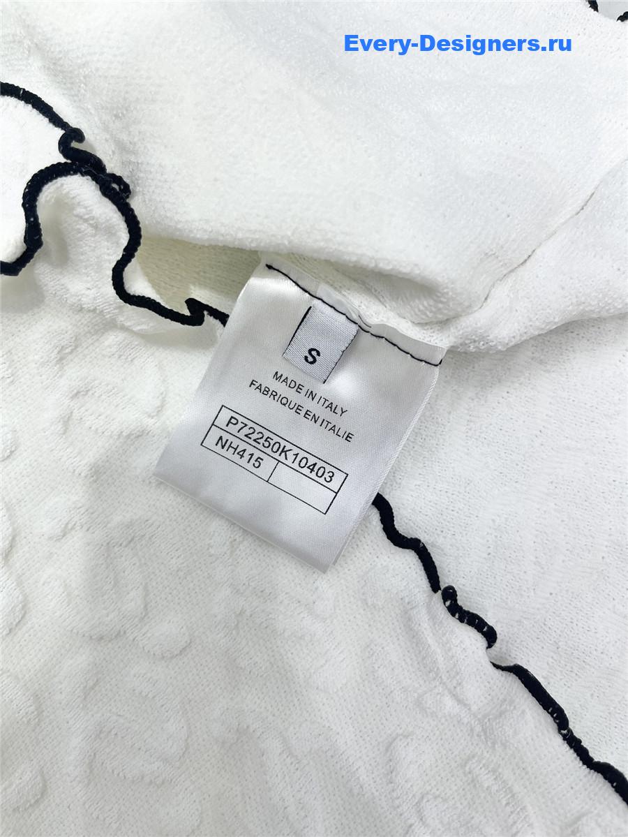 Ch**el embroidered wool-silk top in white