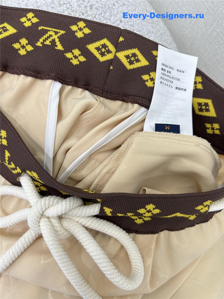 l0vis Vvtt0n beige monogram wide-leg trousers