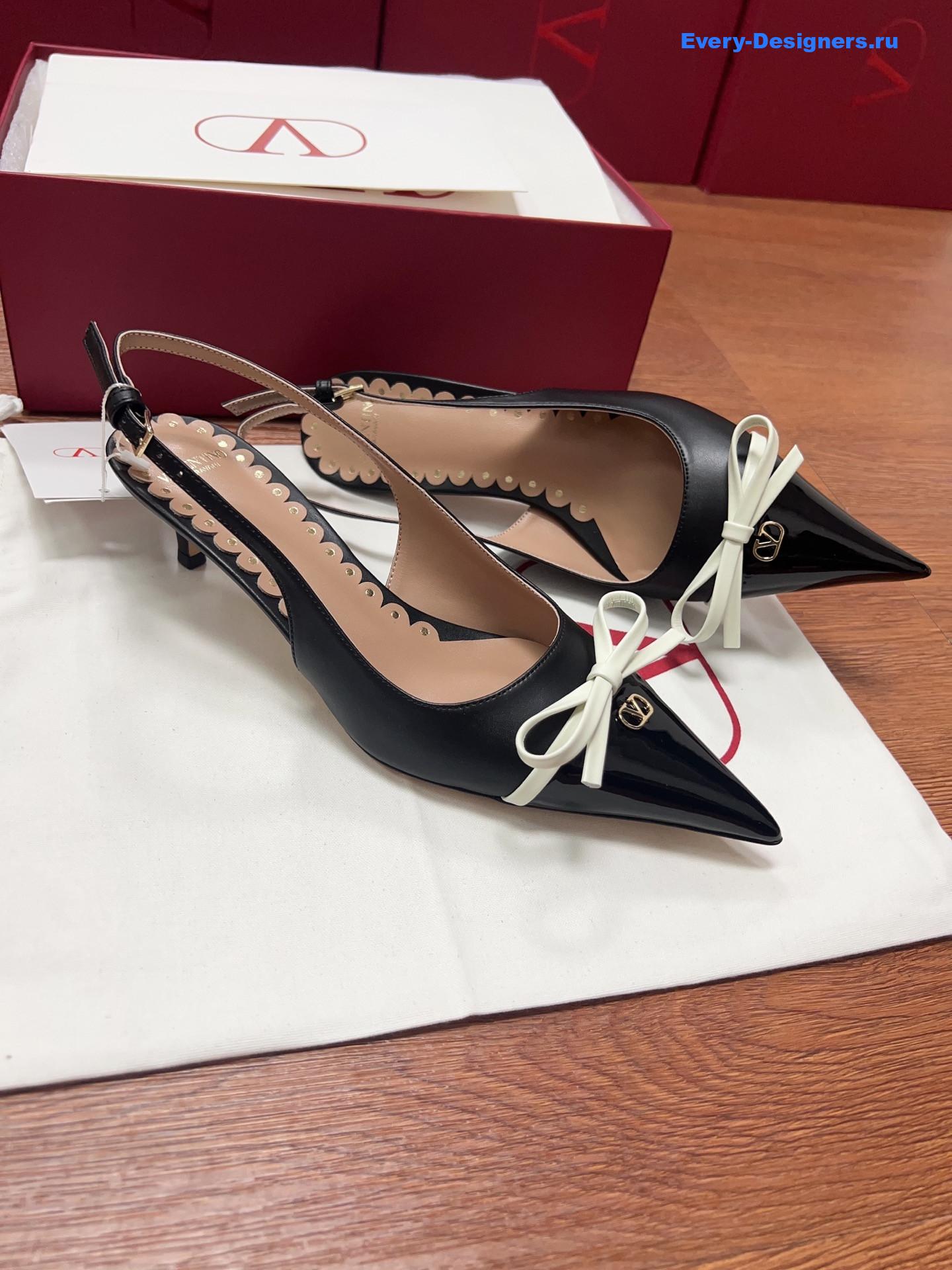 Va1e*ntin0 garavani bow slingback pumps in black