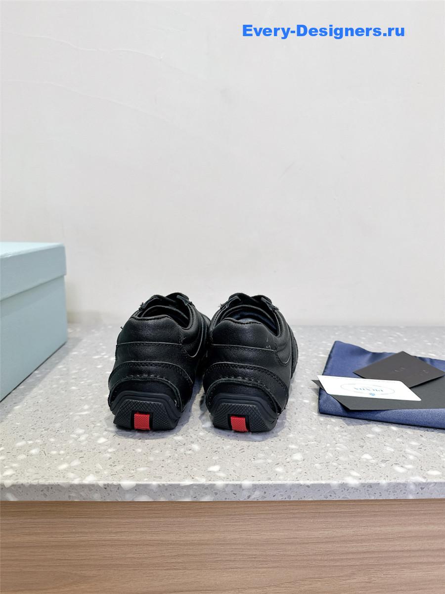 Pra*a black leather low-top sneakers