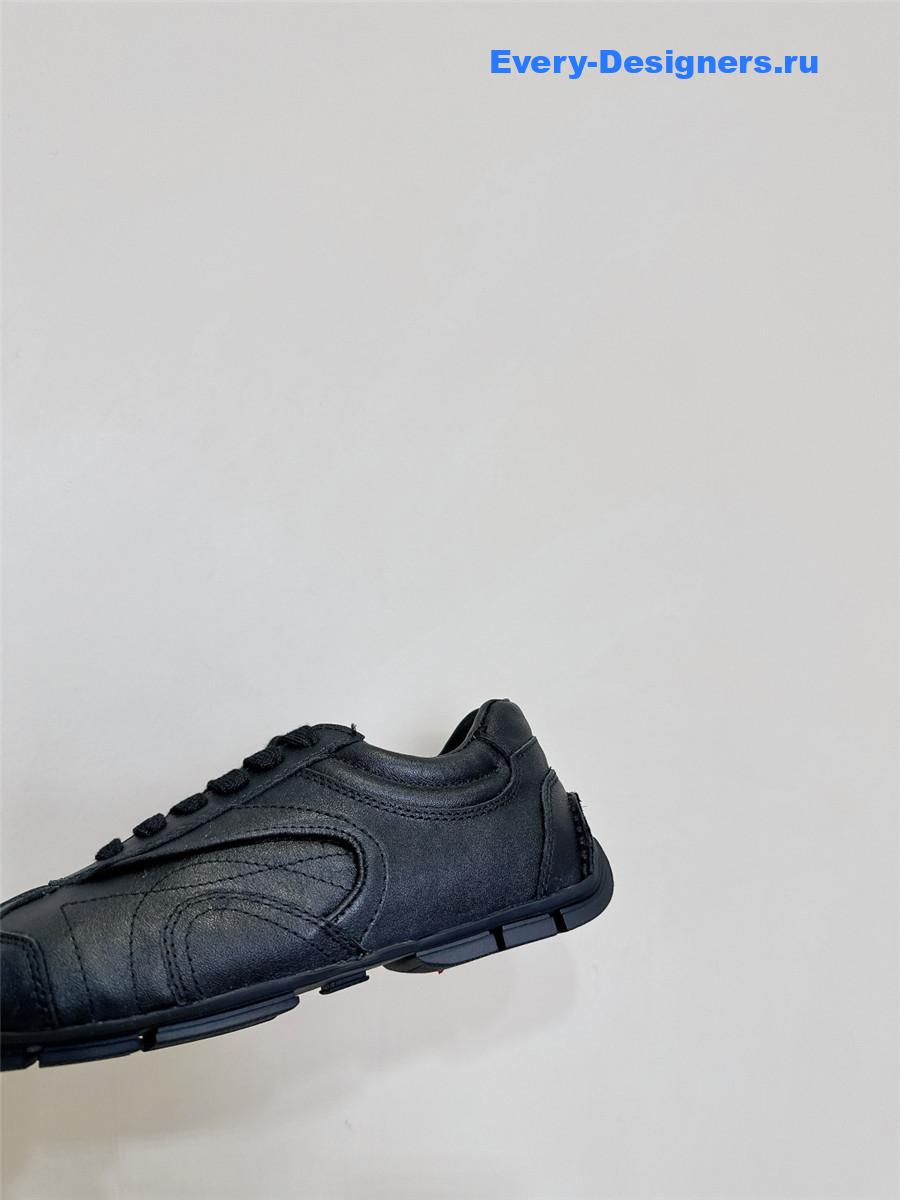 Pra*a black leather low-top sneakers