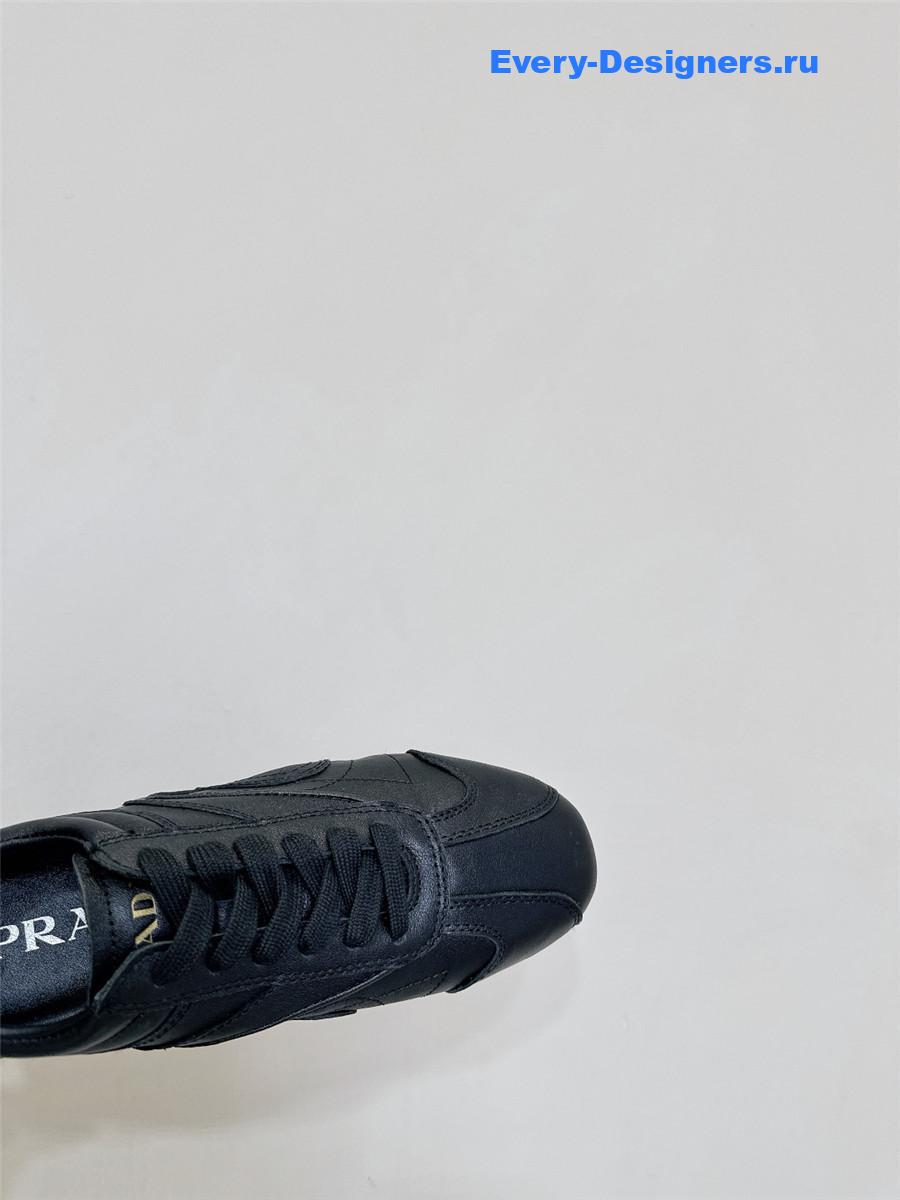 Pra*a black leather low-top sneakers