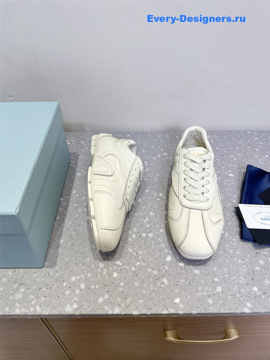 Pra*a white leather low-top sneakers