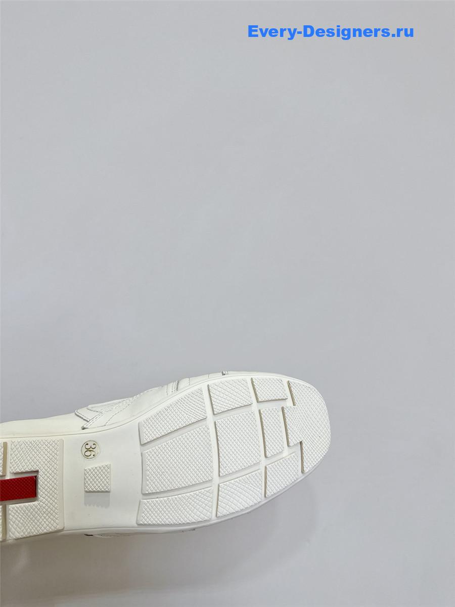 Pra*a white leather low-top sneakers