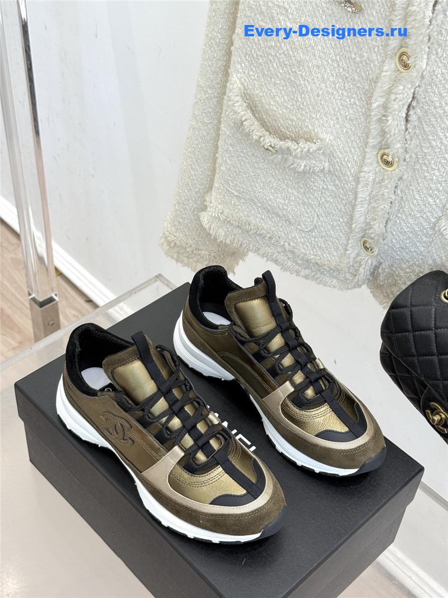 Ch**el laminated calfskin suede gold trainers