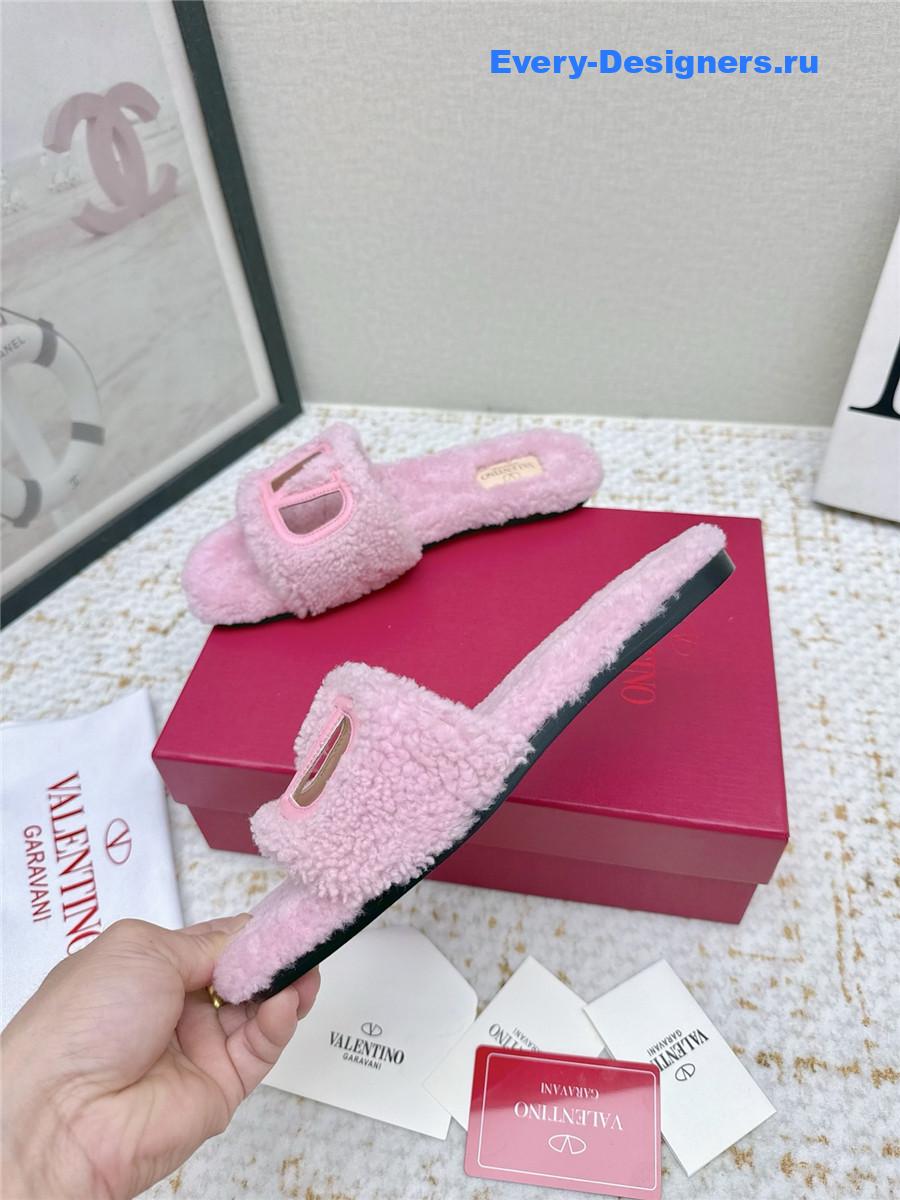 Va1e*ntin0 pink vlogo cutout faux shearling slides