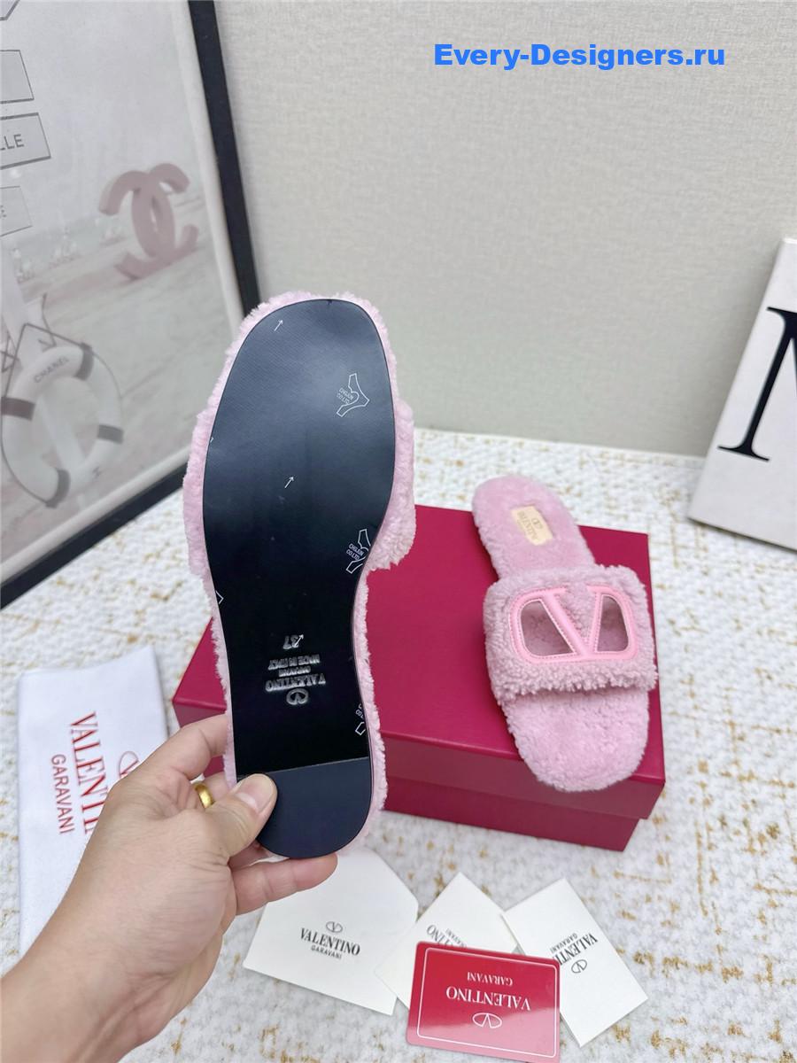 Va1e*ntin0 pink vlogo cutout faux shearling slides